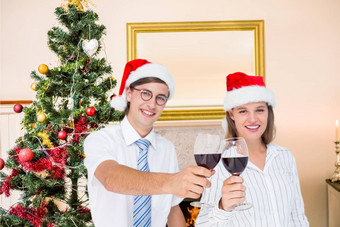 肖像快乐夫妇圣诞老人他敬酒红色的酒