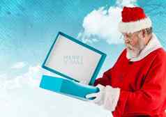 圣诞老人老人开放礼物盒子