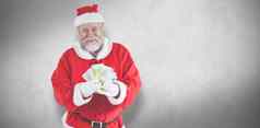 复合图像圣诞老人老人显示货币笔记