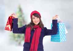 快乐女人持有购物袋圣诞节背景