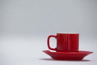 特写镜头红色的咖啡杯飞碟
