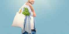 复合图像肖像男人。携带蔬菜购物袋