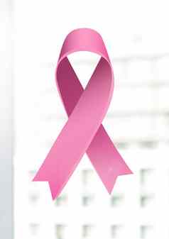 粉红色的丝带乳房癌症意识明亮的背景