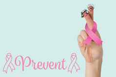 复合图像粉红色的乳房癌症意识丝带裁剪手女人