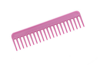 粉红色的头发梳子孤立的白色背景