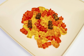 泰迪熊算色彩斑斓的果冻豆子板白色背景