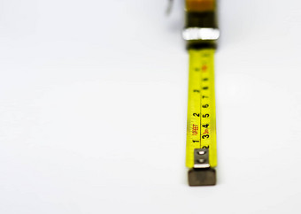 可伸缩的黄色的金属测量磁带测量表达了厘米脚