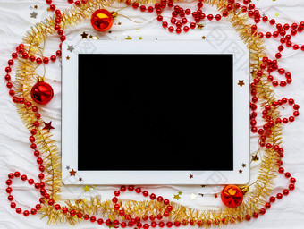 平板电脑冬天假期背景圣诞节装饰红色的黄色的俗丽的明星闪光珠子