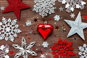 圣诞节一年背景圣诞节装饰球星星银闪闪发光的雪花五彩纸屑木表格