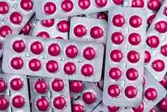 粉红色的平板电脑药丸泡包止痛药医学治疗