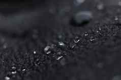 水滴黑色的皮革背景纹理宏特写镜头