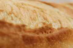 新鲜的法国卷魔杖纹理地壳面包食物背景宏特写镜头