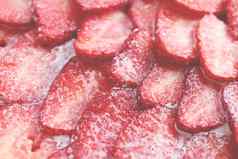 新鲜的维生素浆果背景切片草莓糖奶油填充背景红色的健康的美味的草莓的糖李子纹理