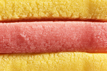 黄色的光红色的彩色的泡沫口香糖纹理新鲜橡皮糖美味的背景美味的背景宏特写镜头