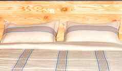 床上亚麻纹理美丽的米色棉花织物背景床头板使木