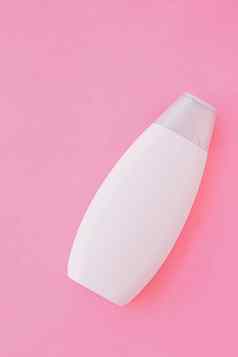 空白标签洗发水瓶淋浴过来这里粉红色的背景美产品身体护理化妆品