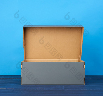 空开放纸板<strong>盒子鞋</strong>子蓝色的背景
