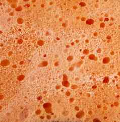 纹理湿橙色浴巾白色泡沫完整的框架