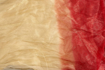 皱巴巴的橙色系薄纱织物缝纫衣服完整的框架