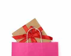 粉红色的纸袋礼物盒子白色背景
