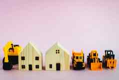 黄色的玩具重机械木房子模型