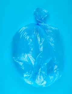 蓝色的塑料袋垃圾蓝色的背景
