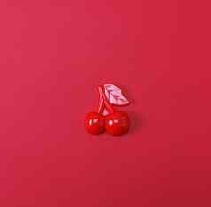 红色的塑料儿童玩具樱桃红色的背景