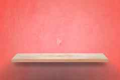 空木架子上难看的东西粉红色的墙背景