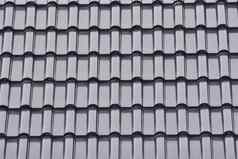集团灰色的瓷砖屋顶模式纹理灰色的背景