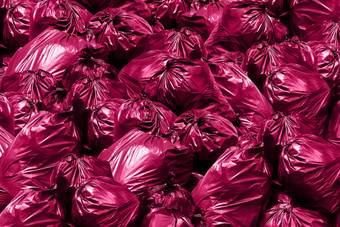塑料浪费背景垃圾转储本垃圾垃圾垃圾塑料袋桩<strong>垃圾袋</strong>粉红色的紫色的