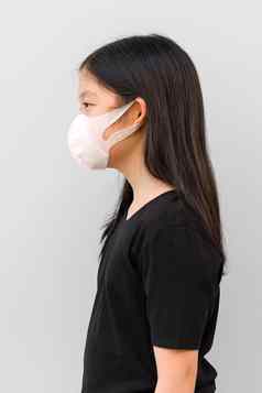 亚洲孩子穿面具防止电晕病毒科维德