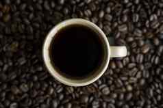 杯咖啡烤咖啡豆子背景杯子黑色的咖啡