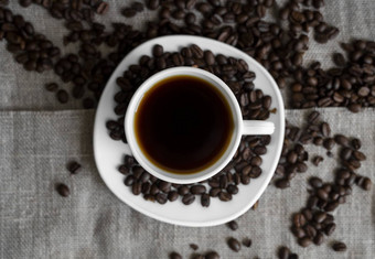 咖啡杯烤<strong>咖啡豆</strong>子亚麻背景杯子黑色的咖啡分散<strong>咖啡豆</strong>子新鲜的<strong>咖啡豆</strong>子