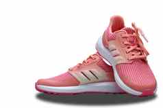 粉红色的体育运动鞋子孤立的白色背景
