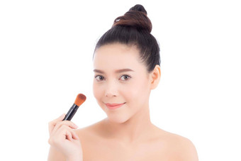 美肖像亚洲女人应用使刷脸颊孤立的白色背景美丽的女孩持有脸红的人护肤品化妆品概念