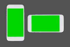 智能手机绿色剪裁内部孤立的灰色的背景