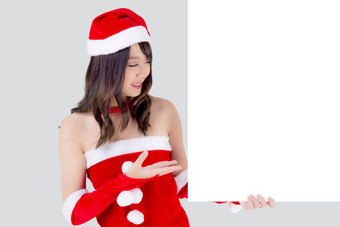 美丽的年轻的亚洲圣诞<strong>老人</strong>女人持有空白董事会圣诞节孤立的白色背景美模型亚洲女孩显示空横幅纸<strong>海报</strong>圣诞节假期一年广告