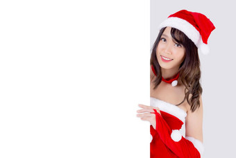美丽的年轻的亚洲圣诞老人女人持有空白董事会圣诞节孤立的白色背景美模型亚洲女孩显示空横幅纸海报圣诞节假期一年广告