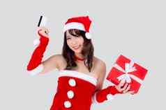 美丽的肖像年轻的亚洲女人快乐持有信贷卡红色的礼物盒子圣诞节假期孤立的白色背景美亚洲女孩惊喜购物信贷卡圣诞节一天