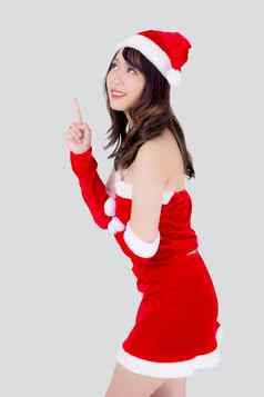 美丽的肖像年轻的亚洲女人圣诞老人服装微笑现在指出圣诞节假期模型亚洲女孩快乐的幸福庆祝圣诞节孤立的白色背景