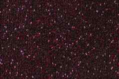 黑色的文学作品的杂集手动针织织物红色的粉红色的斑点无缝的纹理平背景
