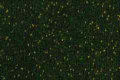 黑色的文学作品的杂集手动针织织物绿色黄色的斑点无缝的纹理平背景