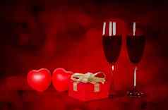 葡萄酒杯红色的礼物盒子心形状桌子上红色的模糊散景背景香槟眼镜礼物庆祝活动周年纪念日爱浪漫的情人节一天概念