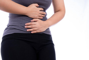 女人痛苦胃疼痛受伤孤立的白色背景健康护理医疗概念