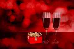 葡萄酒杯红色的礼物盒子桌子上红色的模糊散景背景香槟眼镜礼物庆祝活动周年纪念日爱浪漫的情人节一天概念