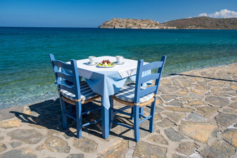 克里特岛希腊Plaka拉西蒂<strong>传统</strong>的蓝色的表格椅子海滩克里特岛希腊paralia<strong>海报</strong>Plaka村克里特岛