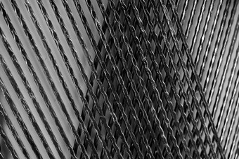 建筑金属面板装饰建筑墙黑色的银金属装饰材料扭曲的铁线面板摘要背景粗糙的铁纹理建筑墙体系结构设计