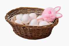 复活节白色鸡蛋篮子统一的粉红色的背景的地方文本