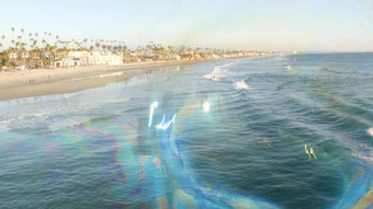 吹肥皂泡沫海洋码头加州模糊夏季背景有创意的浪漫的比喻概念做梦幸福魔法摘要象征童年幻想自由
