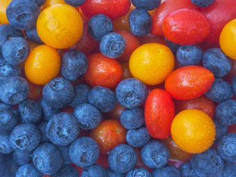 混合浆果水果食物背景特写镜头纹理蓝莓黄色的角醋栗红色的樱桃番茄